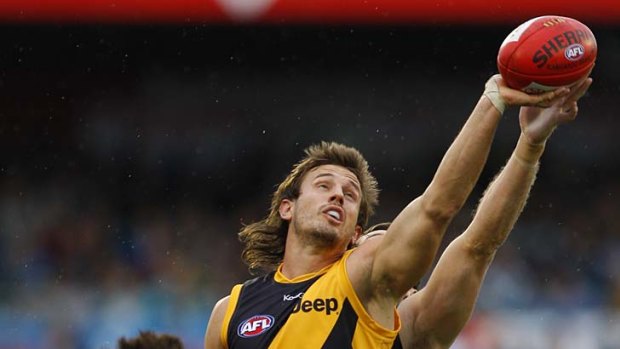 Full marks: Tiger ruckman Ivan Maric takes a one-handed grab against Port yesterday.