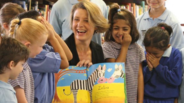Keen to read ... Premier Kristina Keneally reads to students at Mascot Public School.
