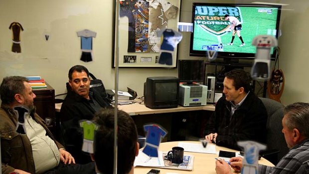 Smile for the camera ... Mal Meninga visits the NRL match review committee.