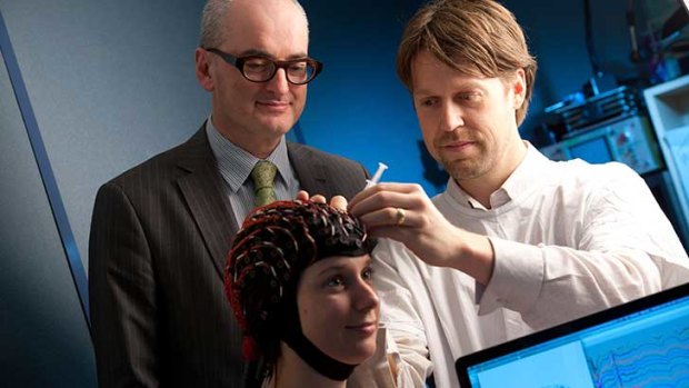 Professor Mark Cook (left) and colleagues participating in epilepsy research.