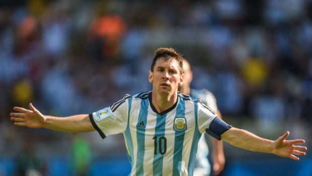 Helping sales for Adidas ... Argentine striker Lionel Messi celebrates his goal against Iran.