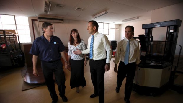 Then Opposition Leader Tony Abbott and Greg Hunt visit Pure Solar, a solar energy company in Fyshwick, in March 2012.
