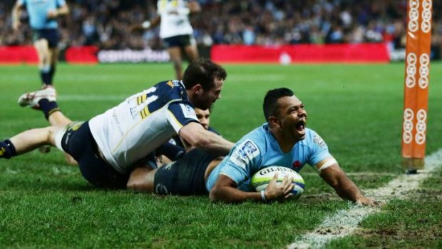 And he's over: Kurtley Beale slides over to score in the corner.