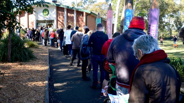 Voters line up outside a polling station in Sydney on Saturday.