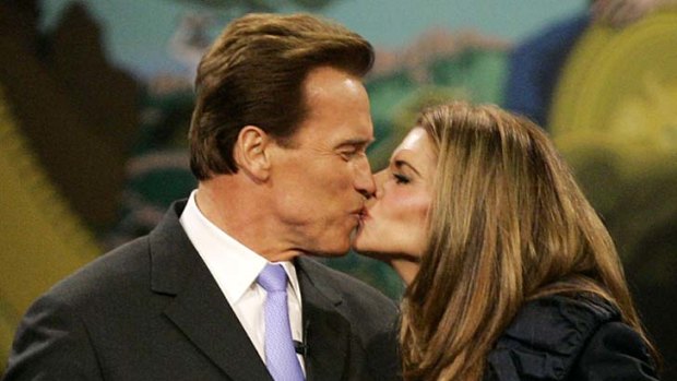 When things were good ... Arnold Schwarzenegger kisses his wife, Maria Shriver.