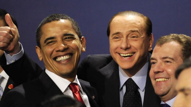 Thumbs up ... US President Barack Obama, left, laughs with Italy's Prime Minister Silvio Berlusconi, centre, and Russia's President Dmitry Medvedev.