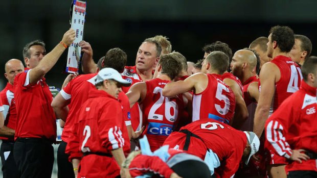 Strategy: Swans coach John Longmire addresses his players during their draw with Fremantle at the SCG on Saturday.