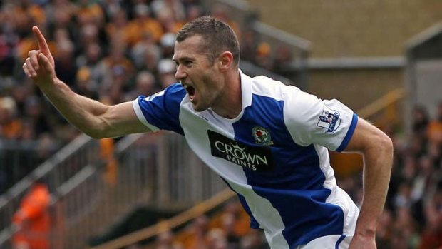 Belter ... Socceroo Brett Emerton celebrates his classic strike at Wolves, his second in two games.