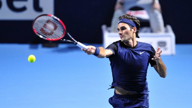 Home town favourite:  Roger Federer in action against David Goffin.
