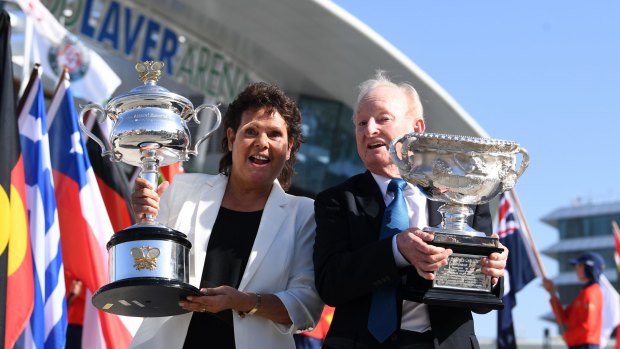 Former tennis players Evonne Goolagong Cawley (left) and Rod Laver hold the men's and women's trophies ahead of the round one matches on day one of the Australian Open in Melbourne.