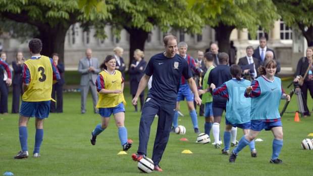 Prince William trains with members of the royal household in the grounds in the grounds of Buckingham Palace.