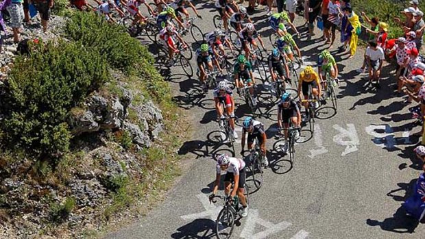 Long and winding road &#8230; the peloton with Bradley Wiggins in yellow snakes up an alpine ascent in Wednesday's 10th stage.