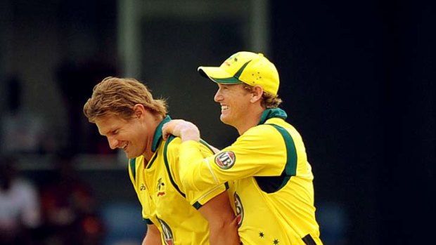 Shane Watson and George Bailey rejoice after Watson dismissed Kieron Pollard to reduce the West Indies to 7-118.