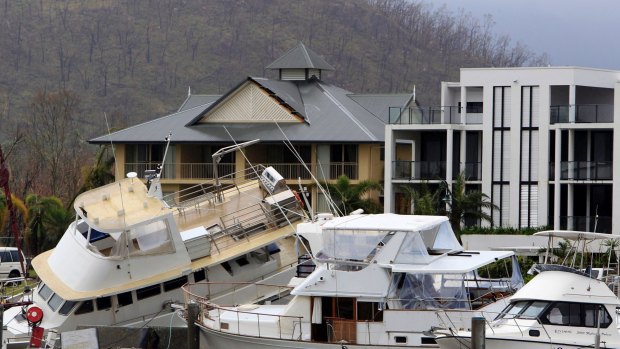 A clutter of boats and yachts are piled together at Port Hinchinbrook after Cyclone Yasi.