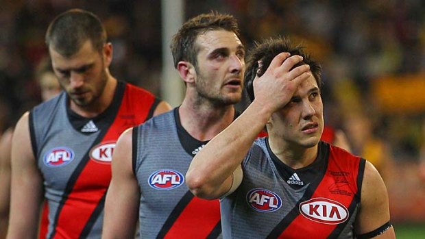 Bombed: Essendon captain Jobe Watson (centre) and Angus Monfries.