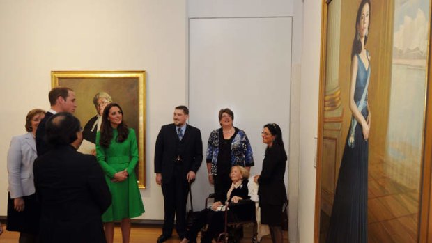 Catherine, Duchess of Cambridge and Prince William, Duke of Cambridge look at a portrait of HRH Crown Princess Mary of Denmark.