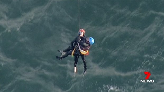 A kite surfer is winched to safety by the police airwing after getting into trouble off Point Henry Beach.
