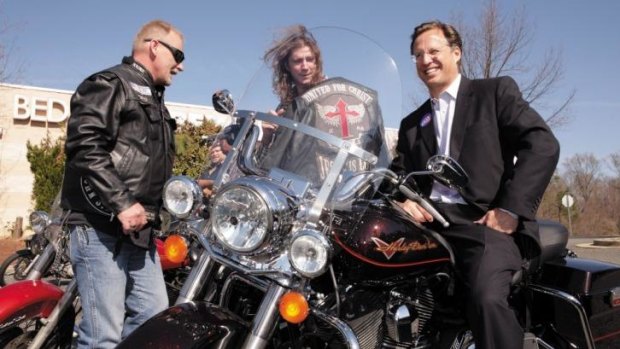 Riding high: David Brat, the conqueror of House majority leader Eric Cantor, on the campaign trail with members of the Heaven's Saints motorcycle ministry in Glen Allen, Virginia.