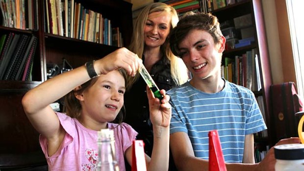 Emotional decision: Sydney mother Lindy Hadges with Ruben, 15, and Odette, 8. Ms Hadges is educating her five children at home as she believes in a more ''organic, fluid'' style of learning.