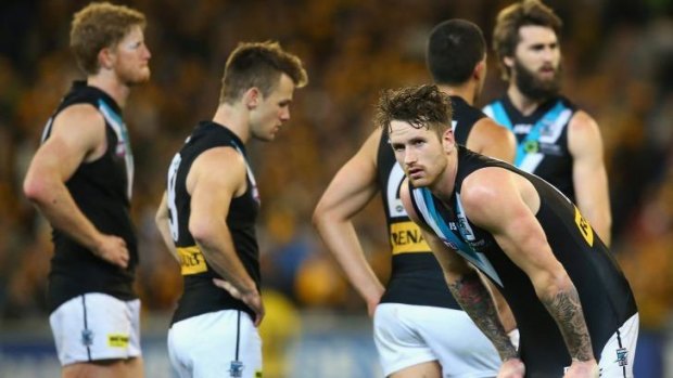 End of the road: Port Adelaide players after losing to Hawthorn in the preliminary final.