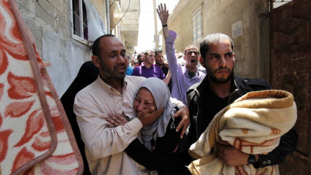 Relatives mourn Haitham Mishal during his funeral in the Shati Refugee Camp in Gaza City on Tuesday.