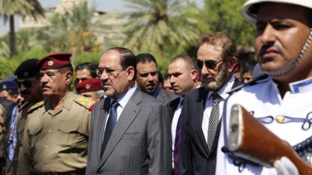 Nouri al-Maliki (centre) has given up on his bid to remain in power in Iraq amid immense pressure.