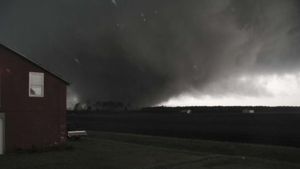 Richard Burkett snapped the picture in Colerain North Carolina, shortly before he and his wife took cover in a closet underneath their stairs.  The tornado hit their barn and came over their house seconds after the picture was taken.