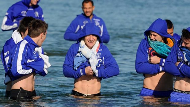 Brent Harvey shares a joke with teammates during a recovery dip at Williamstown.