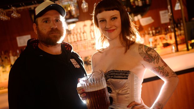 Coming to Chapel Street ... Red Bennies' Jeff Yates, with waitress Tayla, copyrighted the term Schnitz 'n Tits.