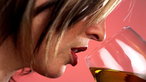 Generic pic of a woman drinking a glass of white wine.