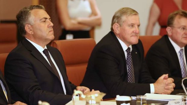 Treasurer Joe Hockey and Industry Minister Ian Macfarlane in a cabinet meeting on Thursday. The two are at odds over industry assistance to SPC.