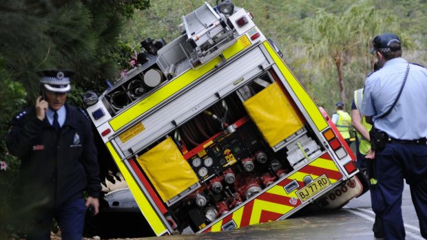 A truck has sunk into the ground after a water main burst.