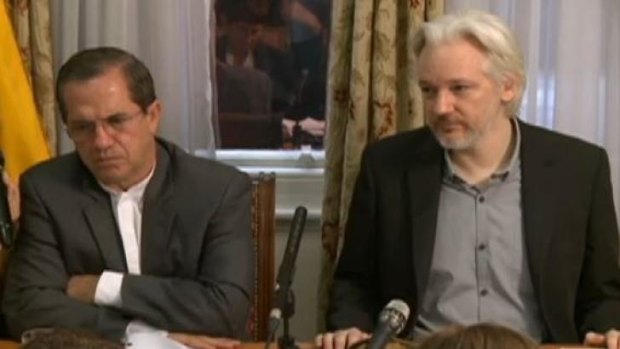 Julian Assange (right) speaks at a press conference with Ricardo Patino, Ecuador's Foreign Minister, in the Ecuadorian embassy in London on Monday.