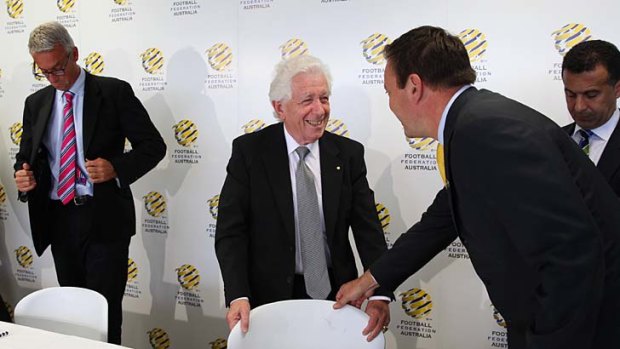 Winners are grinners ... FFA chairman Frank Lowy can't disguise his delight.