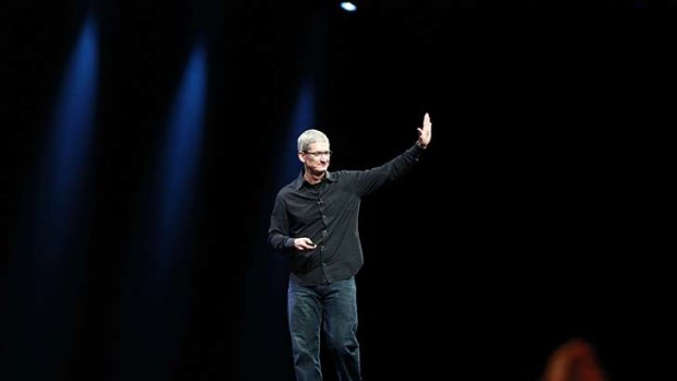 Apple CEO Tim Cook acknowledges the crowd at the end of his keynote speech.