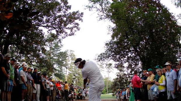Out of the woods &#8230; Bubba Watson launches his amazing shot from the woods on the 10th to set up victory.
