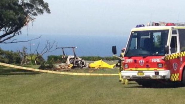 Fire and rescue workers arrive at the scene of a fatal helicopter crash at Bulli Tops.
