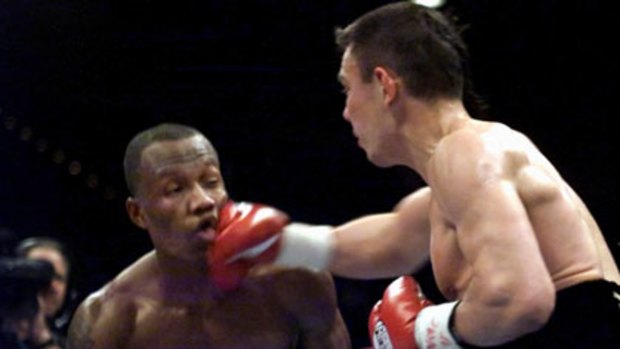 Killer blow ... Kostya Tszyu, right, knocks out Zab Judah during the second round of their light-welterweight unification bout in 2001.