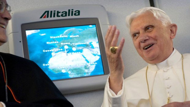 Speaking out ... Pope Benedict XVI gives a press conference during the flight to Yaounde.