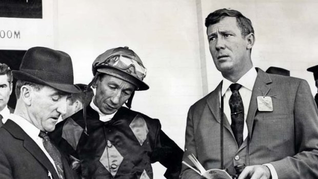 Lloyd Foyster with horse trainer Arthur Ward, far left, and jockey George Moore, centre.