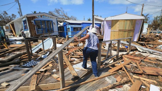 A woman walks through the debris at the Seabreeze trailer park in the Florida Keys on Tuesday, after Hurricane Irma hit the area.