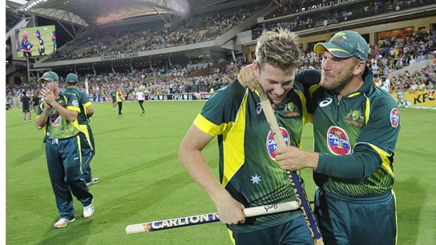 Australia's James Faulkner and Aaron Finch celebrate victory after the fifth ODI against England.