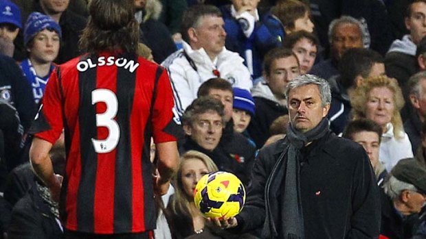 Face off: Chelsea manager Jose Mourinho looks at Jonas Olsson during the match against West Bromwich Albion on Saturday.