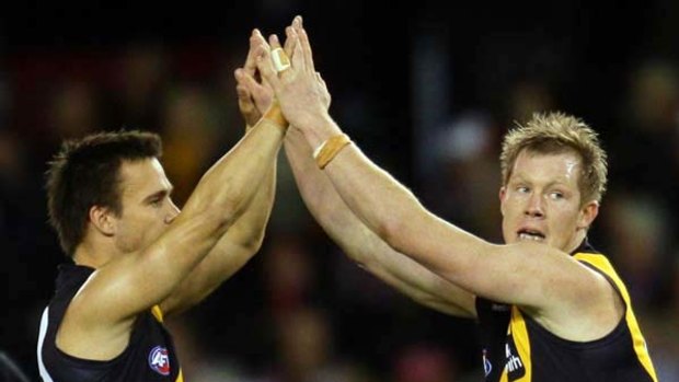 Jack Riewoldt (right), who won the Ian Stewart Medal for his seven goals against the Saints yesterday, high-fives with Jake King.