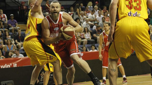 Hawks centre Larry Davidson drives through traffic against Melbourne Tigers in their New Year's Eve clash in Wollongong.