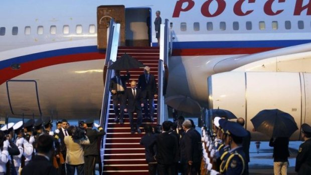 Russia's President Vladimir Putin arrives in Shanghai.