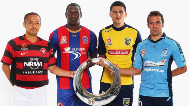 Shinji Ono (Wanderers), Emile Heskey (Jets), Tom Rogic (Mariners) and Alessandro Del Piero (Sydney FC) hold the A-League Trophy.