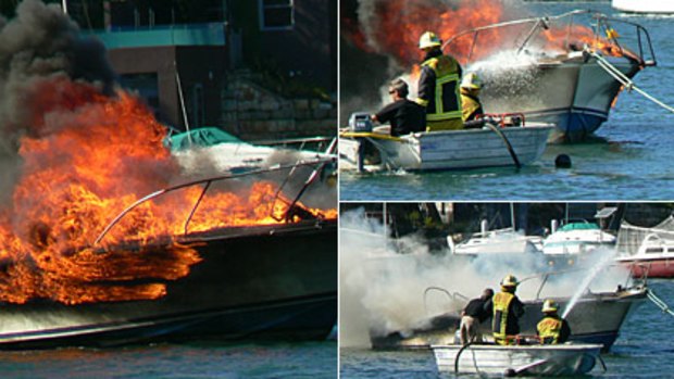 Fire crews battle the boat blaze on Sydney's Middle Harbour this morning.