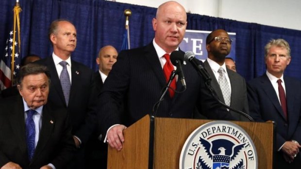 Homeland Security Investigations Special Agent James Haynes, centre, announces the arrest of 71 individuals as part of Operation Caireen, a sweeping investigation into the anonymous trading of child porn over the internet.