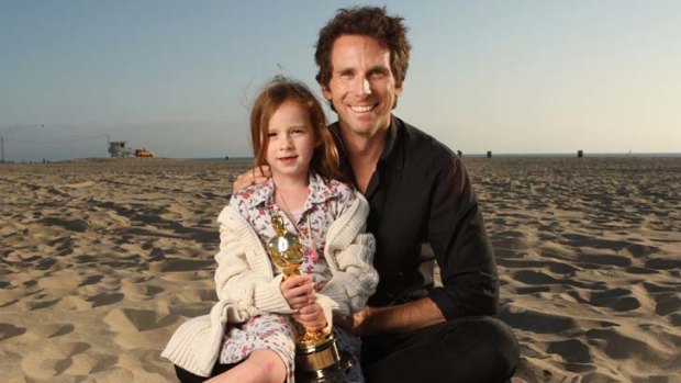 Life's a beach &#8230; Kirk Baxter and his daughter Bronte at Santa Monica with his Oscar for The Social Network. He has been nominated again this year.